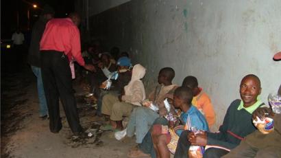 Clifford Oluoch feeding homeless people in Nairobi, Kenya