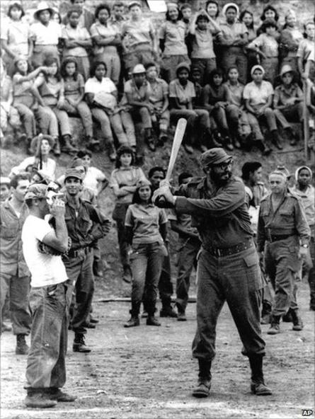 Fidel Castro takes his turn at bat during a baseball game held at a teachers school in the Sierra Maestra area of Cuba