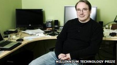 Linus Torvalds in front of computers