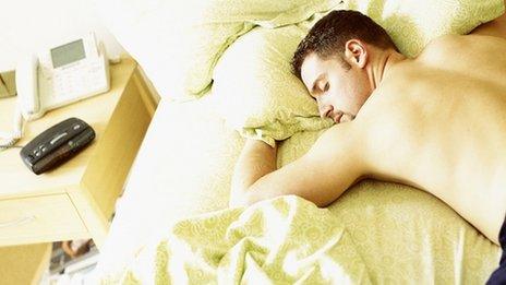 Man asleep in bed