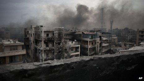 Smoke rises over Saif Al Dawla district, in Aleppo, Syria
