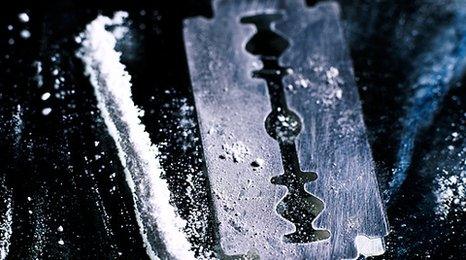 Line of cocaine and razor blade