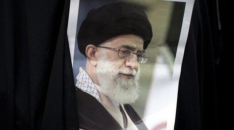 Student holds a picture of the Ayatollah