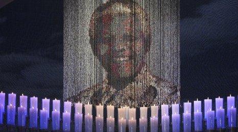 Mandela's picture in front of candles