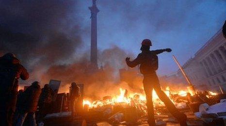 Anti-government protesters clash with the police on Independence Square in Kiev