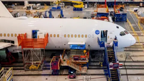 Boeing employees assemble 787s inside their main assembly building on their campus in North Charleston, South Carolina, U.S