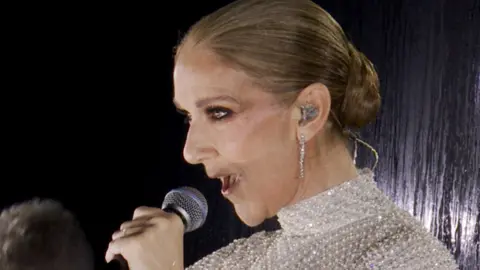 Celine Dion singing at the Olympics opening ceremony
