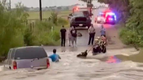 Man is being rescued by first responders.
