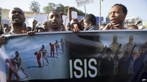Ethiopian demonstrators in Addis Ababa hold a banner during a rally - Wednesday 22 April 2015