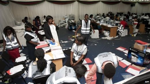 Malawi Electoral Commission workers continue to work out the results of Malawi's elections at the National Tally Centre in Blantyre, 28 May 2014