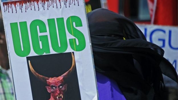 Demonstrator holding placard