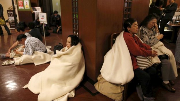 Hotel guests gather at the lobby after another earthquake hit the area in Kumamoto.