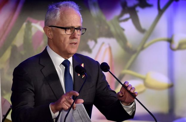 Australian Prime Minister Malcolm Turnbull addresses the crowd at a memorial event at Sydney's Martin Place, marking one year since the Lindt cafe siege