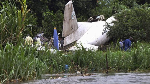 Officials investigate the wreckage of a cargo airplane