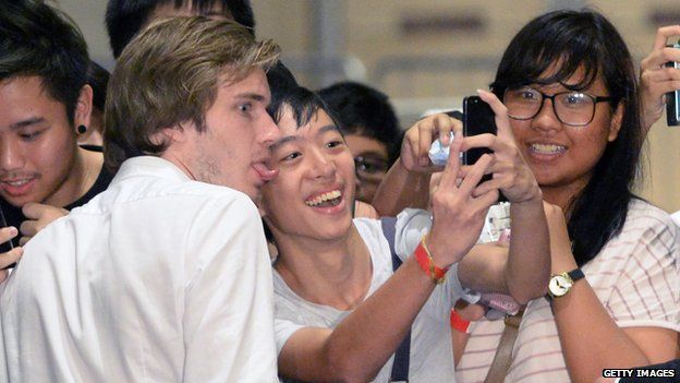 Felix Kjellberg poses for pictures with fans