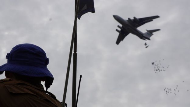 A UN soldier monitors an airdop