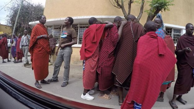 Tanzanite street sellers dressed in Maasai clothing