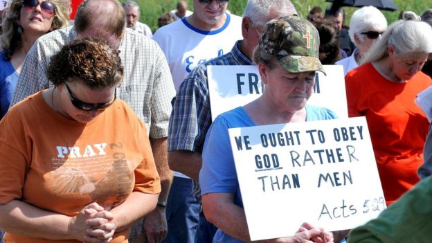 Supporters pray at the Carter County Detention Center for Rowan County clerk Kim Davis, who remains in jail for contempt of court in Grayson, Kentucky 5 September 2015.