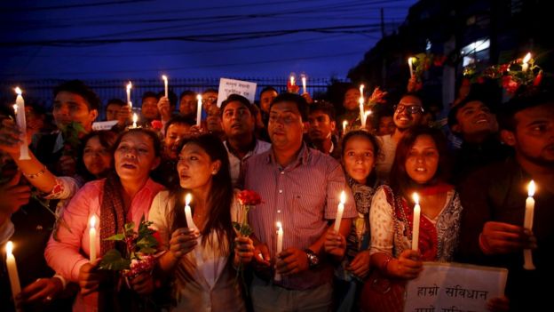 Nepalese students celebrate as they take part in the candlelight vigil welcoming the new constitution in Kathmandu, Nepal September 17, 2015