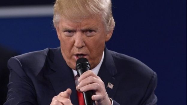 US Democratic Presidential nominee Hillary Clinton and Republican Presidential nominee Donald Trump participate a town hall debate against Republican nominee Donald Trump at Washington University in St. Louis, Missouri, on October 9, 2016