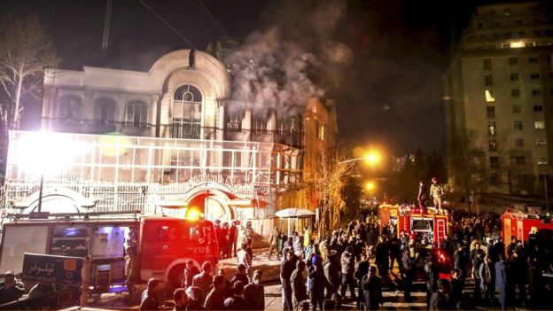 Flames rise from Saudi Arabia's embassy during a demonstration in Tehran on 2 January 2016