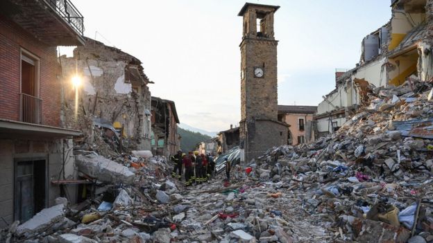 Rubble as the bell tower of Amatrice stands in the background, in Amatrice, central Italy, a week after a deadly quake, on 1 September 2016