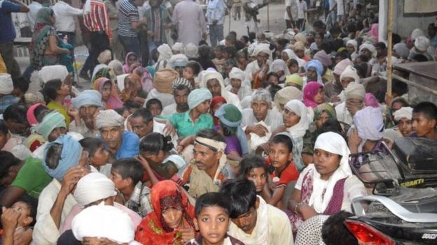 Indian members of a sect said to have been living illegally look on following clashes with police after they were evicted from the Jawahar Bagh park in Mathura on June 2, 2016