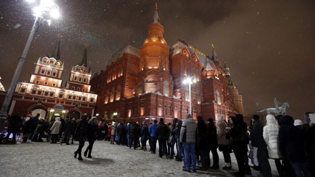 People stand in line for police checks at enter to the Red Square, Moscow, Russia 30 December 2015.