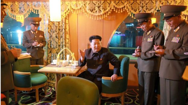 This undated picture released from North Korea's official Korean Central News Agency shows North Korean leader Kim Jong-Un giving out advice during an inspection of the newly-built excursion boat Mujigae