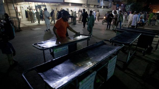 Pakistani hospital staff make arrangements outside an emergency ward for the victims of suicide bombing at a famous shrine in interior Sind province, in Karachi