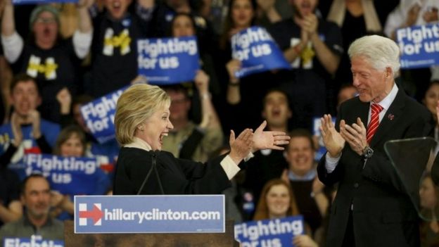 Democratic US presidential candidate Hillary Clinton is applauded by her husband, former US President Bill Clinton in Hooksett, New Hampshire on 9 February 2016.