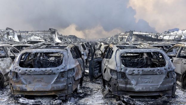 Damaged vehicles at scene of blast in Tianjin on 13 August 2015