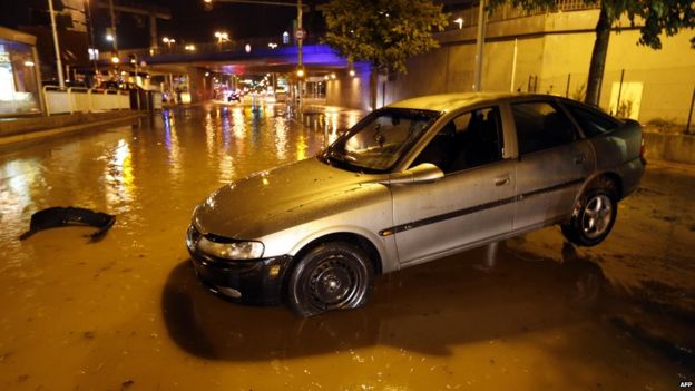 A car dislodged by floodwater in southeast France