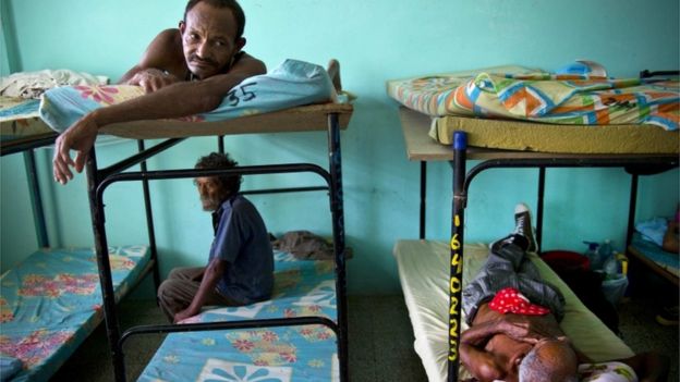 People wait in a shelter ahead of Hurricane Matthew in Guantanamo, Cuba