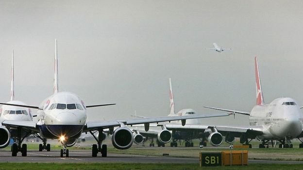 Planes taxi at Heathrow Airport