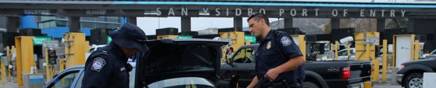 US customs and border patrol officers inspect a vehicle entering the US from Mexico at the border crossing in San Ysidro, California, United States, 14 October
