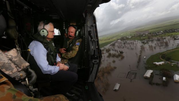 Australia's prime minister visit a cyclone-damaged area in a helicopter