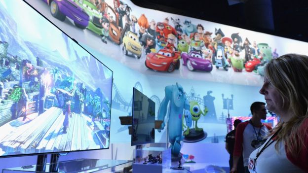 A woman plays Disney Infinity at the E3 conference 2015