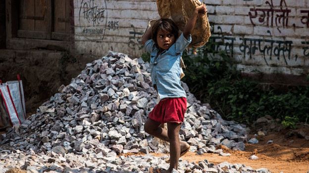 A girl carrying a bag in India