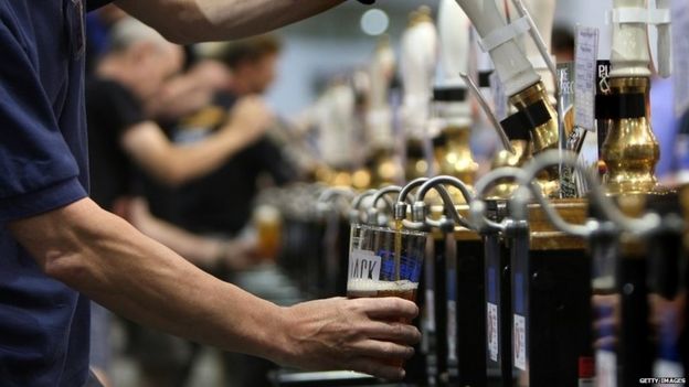 Bartender pulls pint of beer