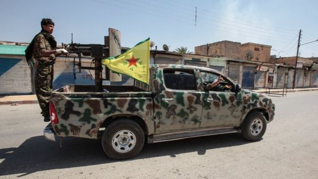 Kurdish People's Protection Units, or YPG fighters control downtown of Tal Abyad, Syria, June 2015