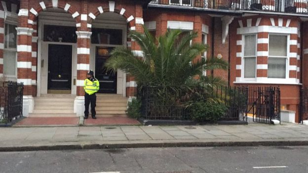 A police officer outside Palmer-tomkinson's flat