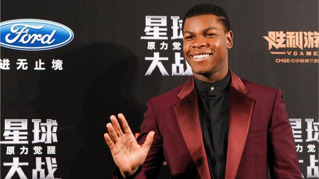 British actor John Boyega waves to fans during the Shanghai premiere of 