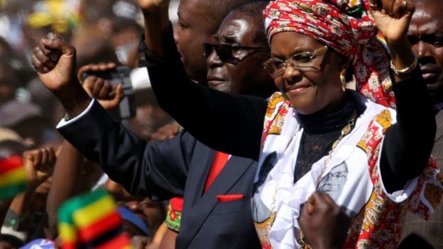 President Robert Mugabe and his wife Grace greet supporters of his ZANU (PF) party during the