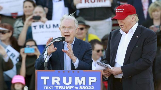 US Senator Jeff Sessions speaks next to U.S. Republican presidential candidate Donald Trump at a rally