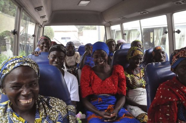 Family members of the Nigerian Chibok kidnapped girls share a moment as they depart to the Nigerian minister of women affairs in Abuja, Nigeria, Tuesday, Oct. 18, 2016.