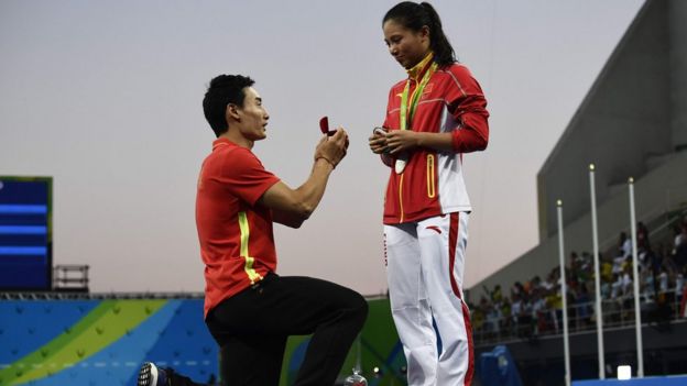 Qin Kai (L) proposes