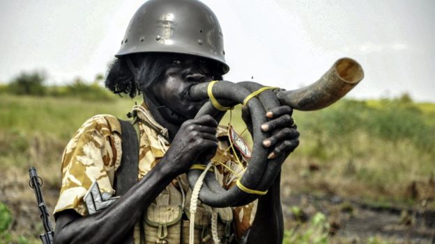 A soldier blowing a horn during a military operation in Eastern Nile State, South Sudan - Sunday 16 October 2016
