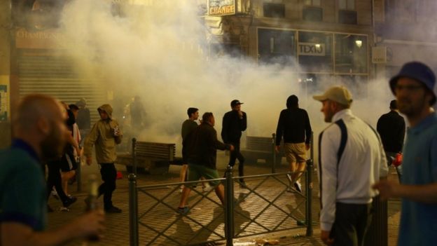 England fans running through tear gas in Lille, France, 15 June