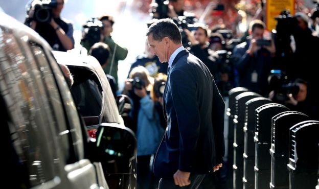 Michael Flynn emerges from a plea hearing in a Washington DC courtroom